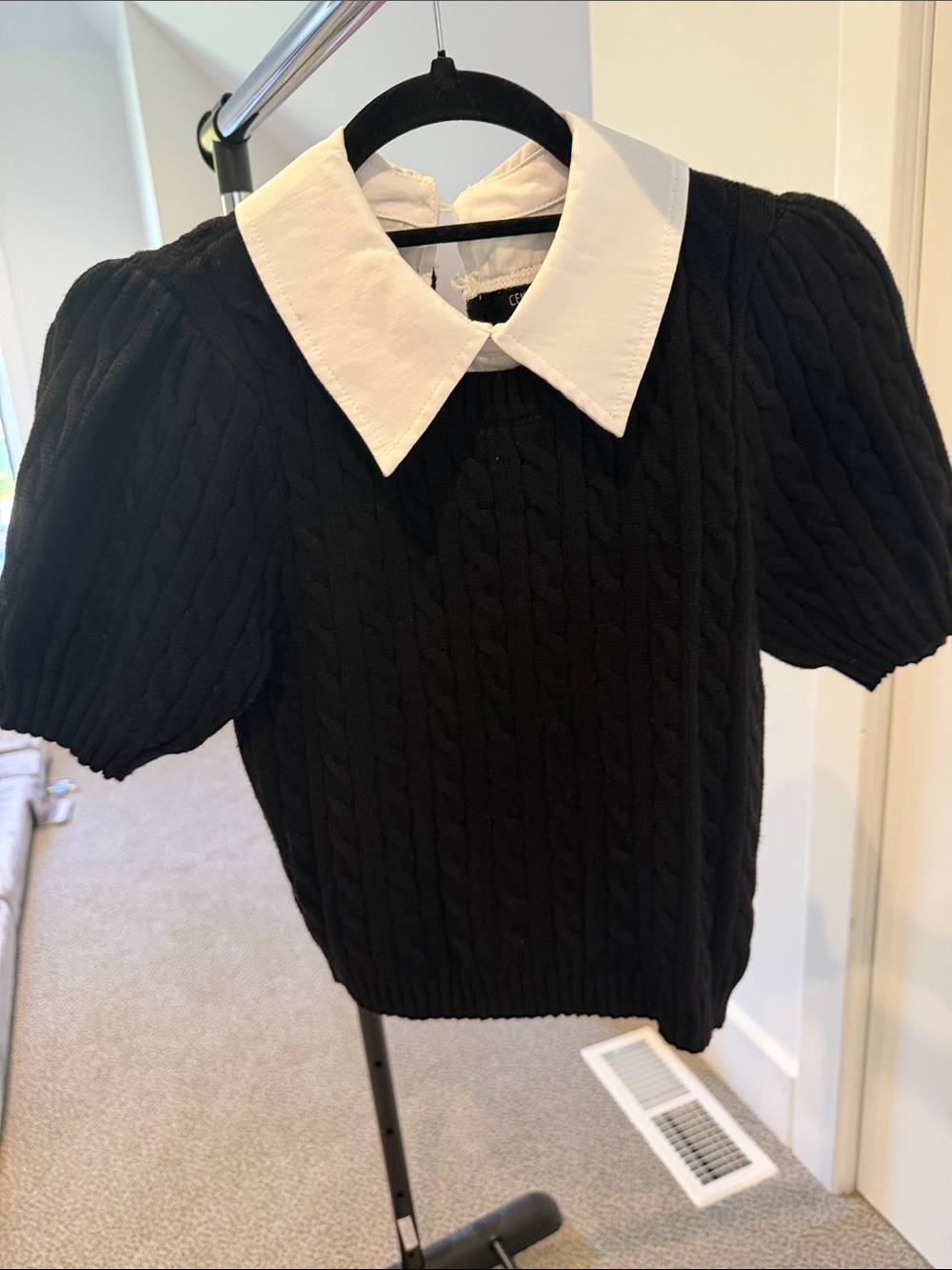 Central Park West Black Cable-Knit Sweater with White Pointed Collar